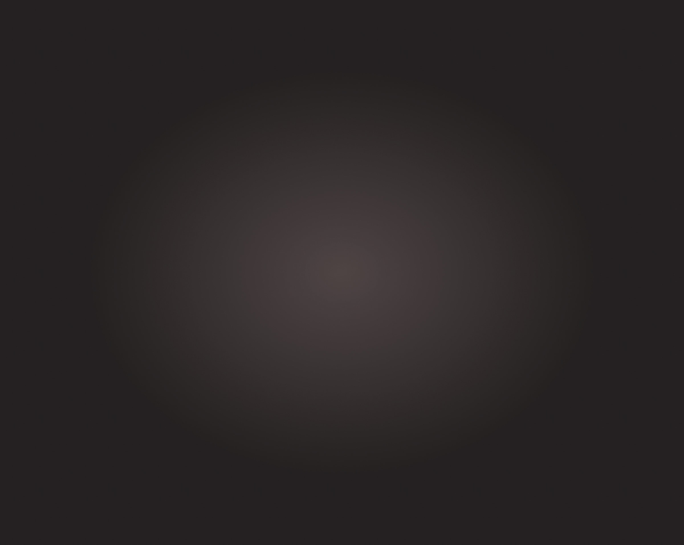 Abstract dark gradient background with soft center.