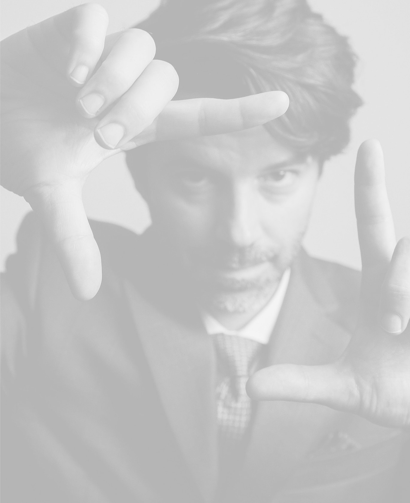 Man framing a shot with his hands.