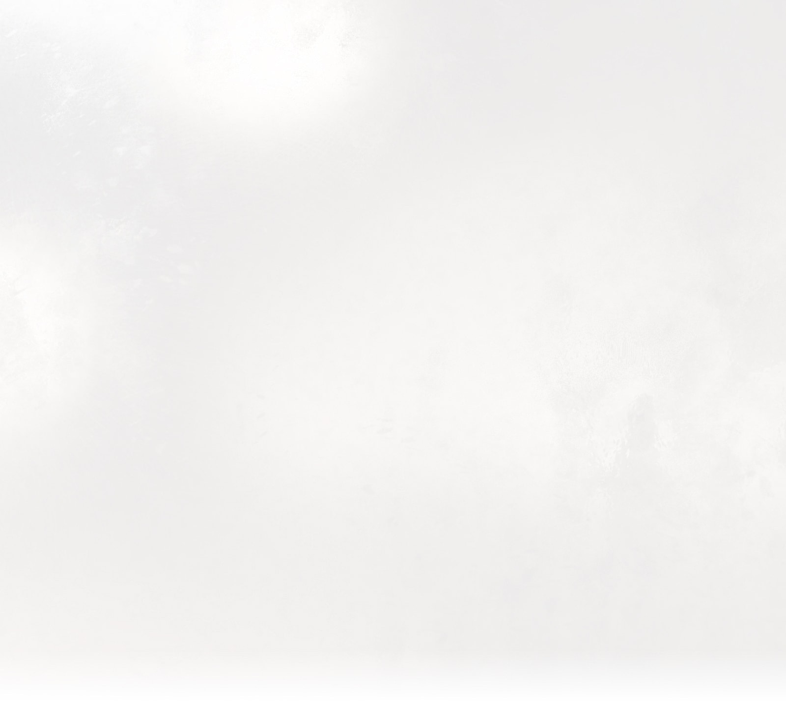 Abstract white textured background with subtle gradient.