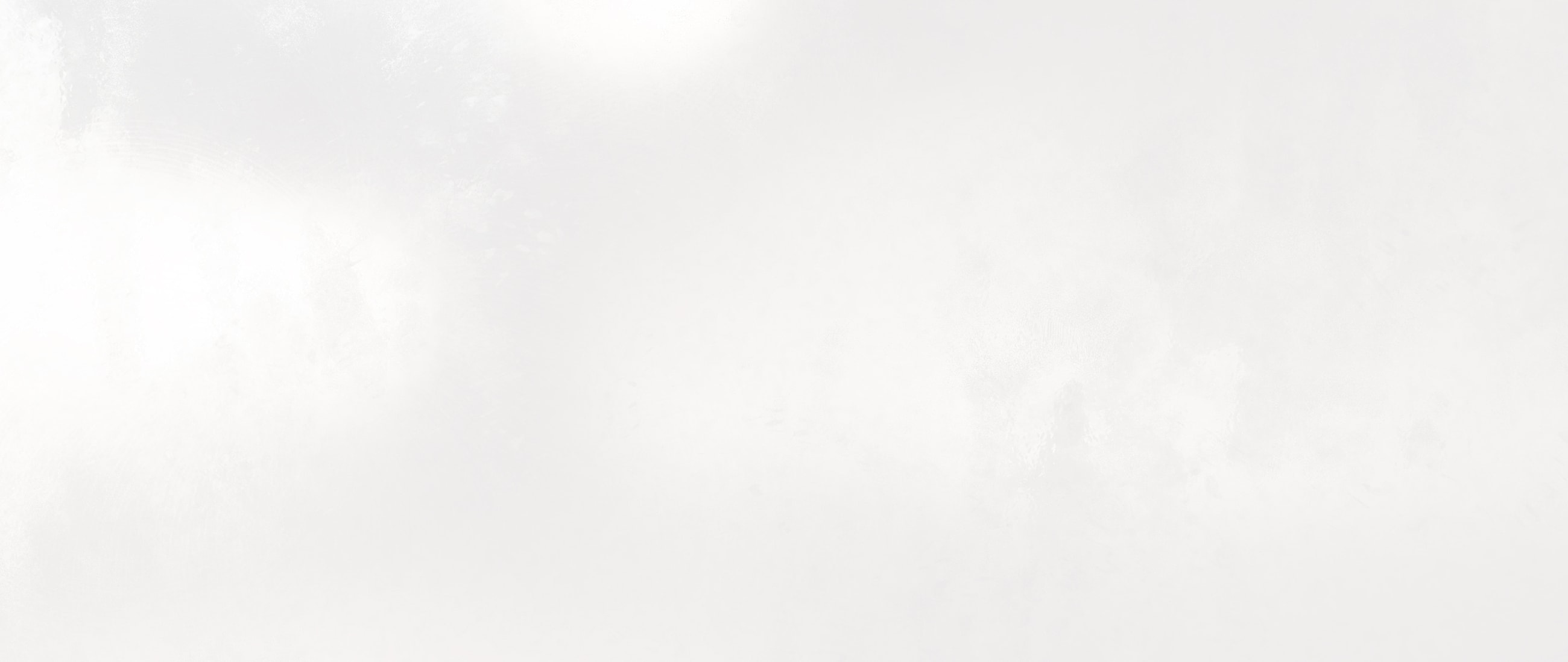 Abstract light-colored textured background.