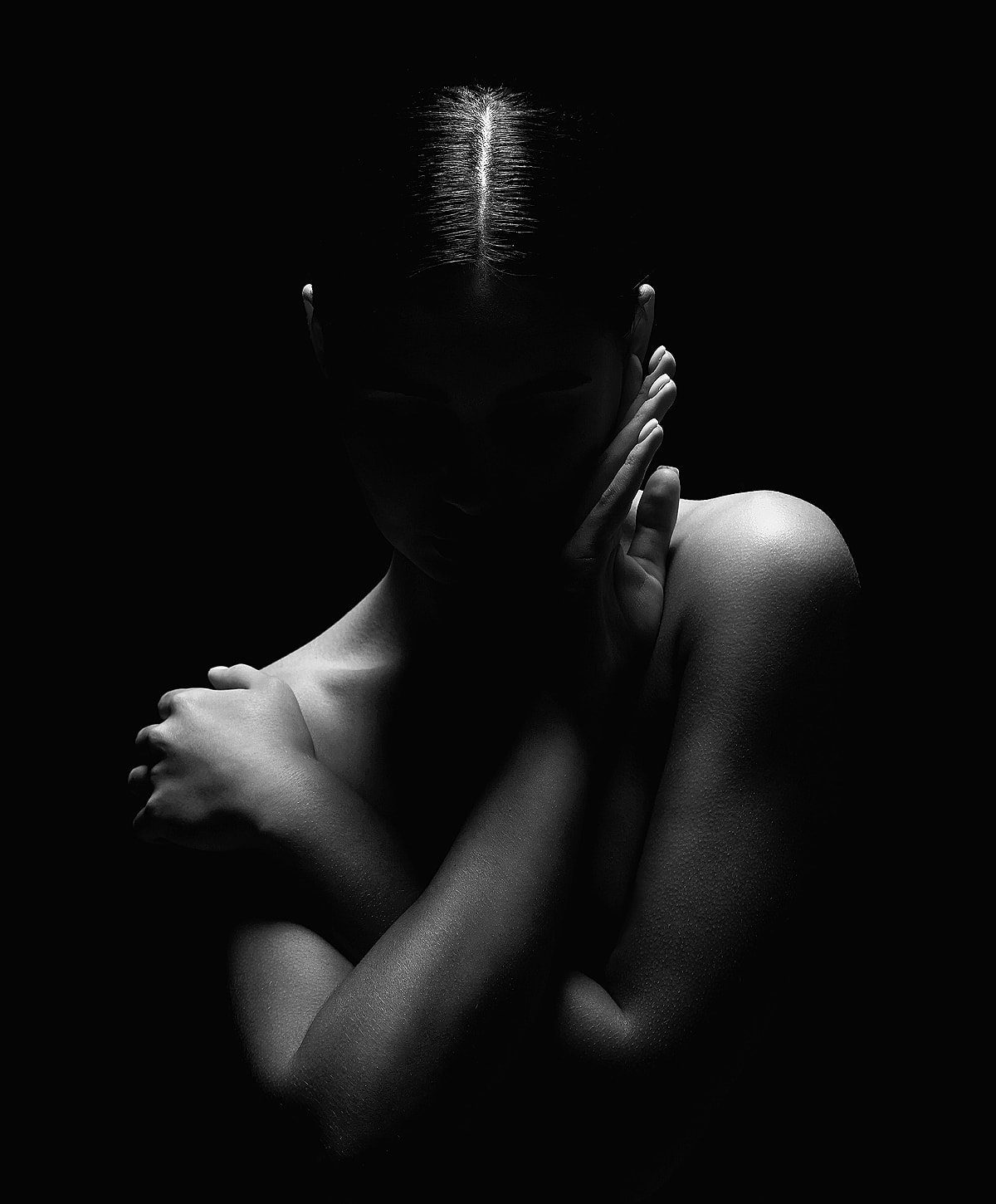 Silhouette of a woman in dramatic lighting.