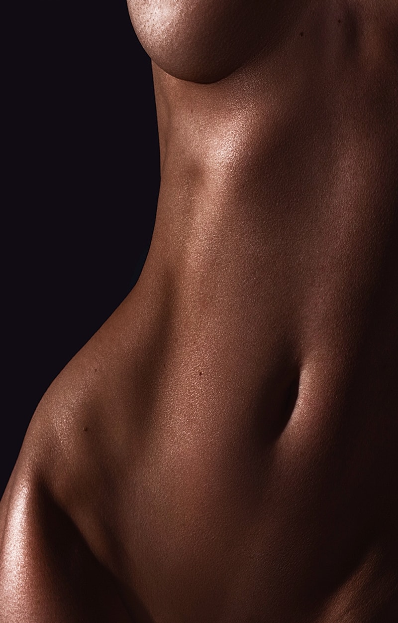 Close-up of smooth skin and torso details.