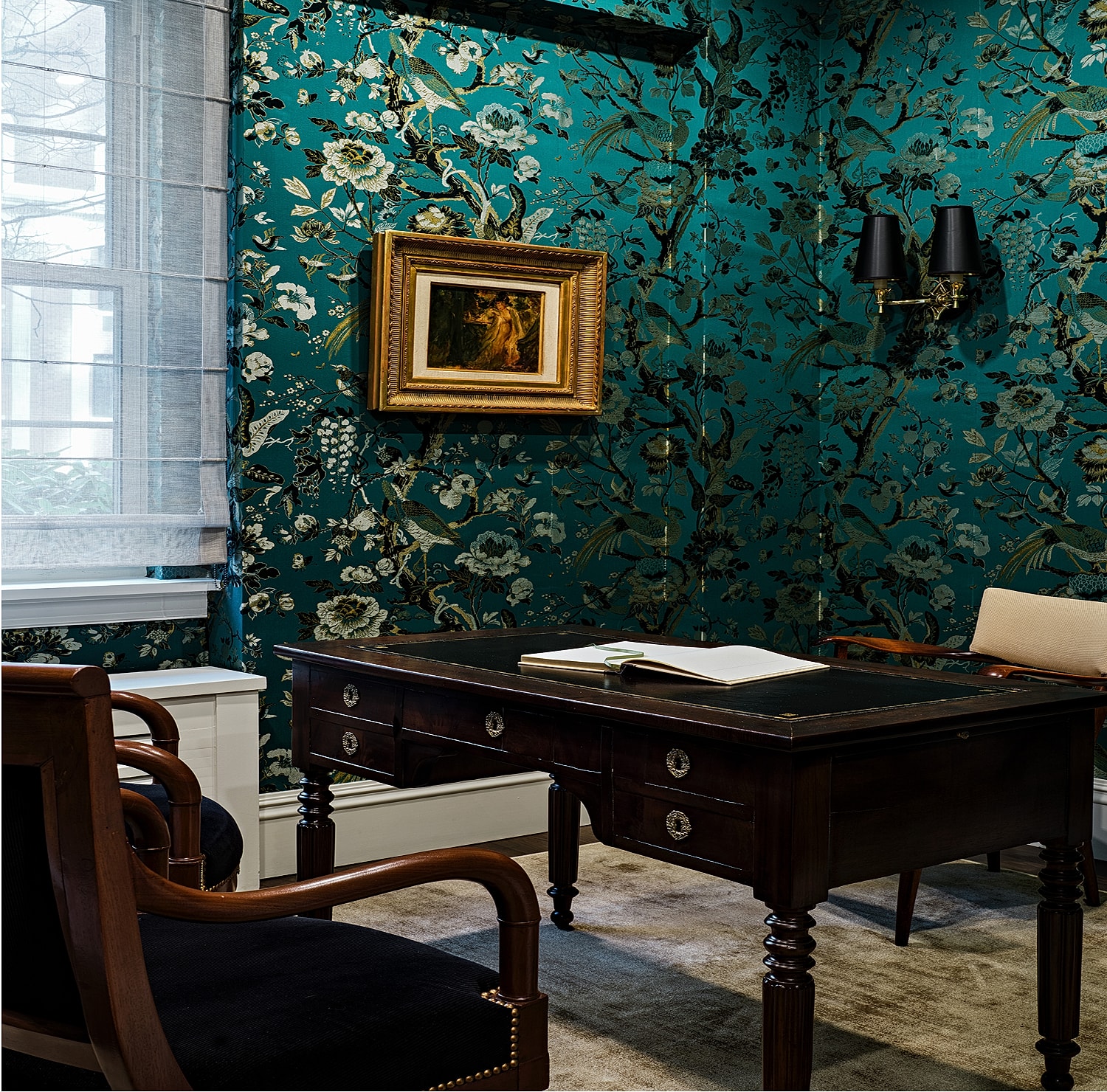 Elegant office with floral wallpaper and antique furniture.