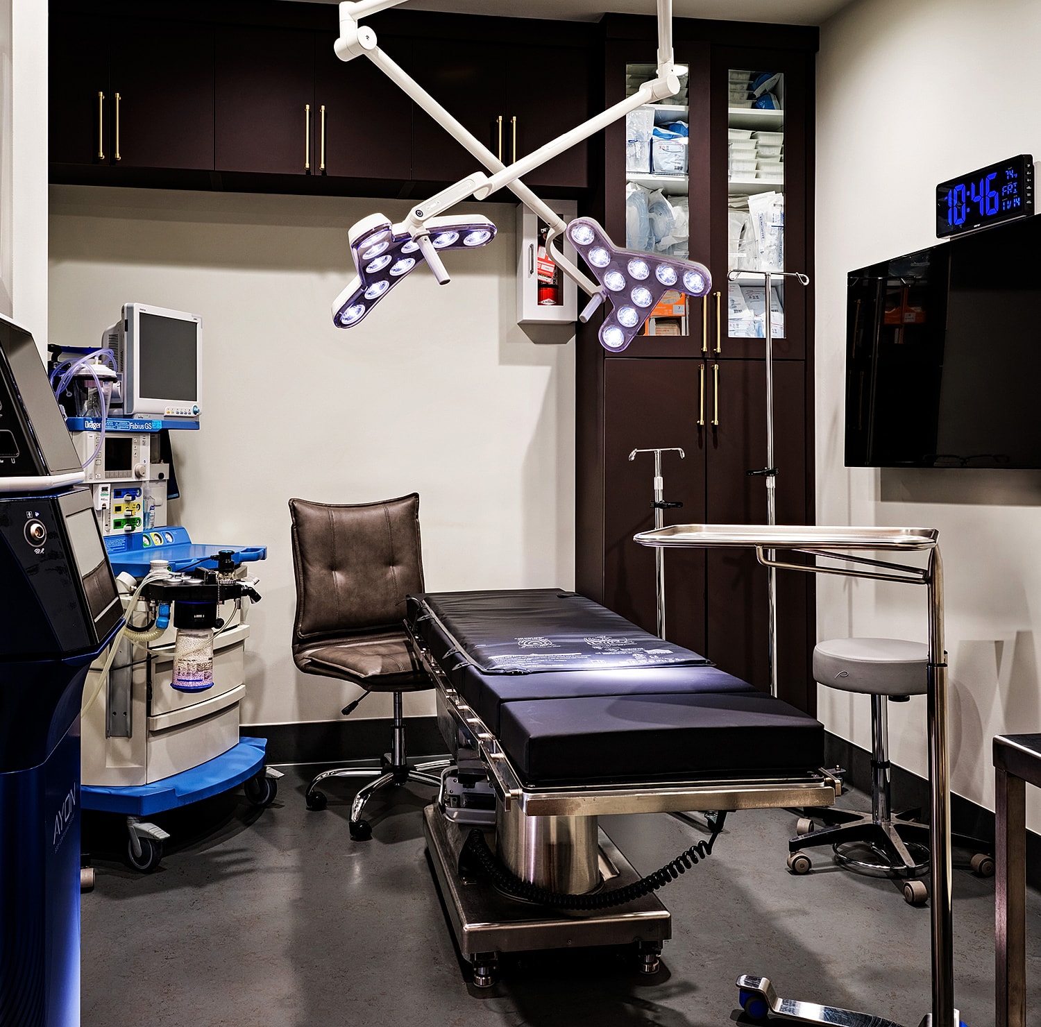 Modern operating room with surgical equipment.