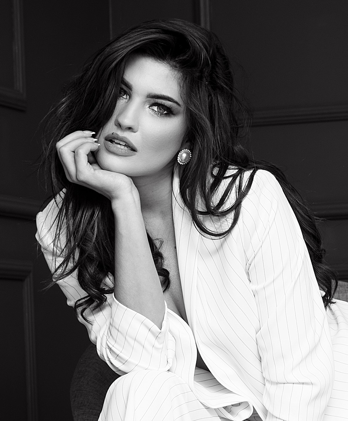 Portrait of a woman in stylish attire.