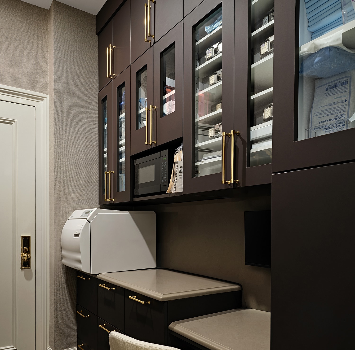 Modern kitchen cabinetry with appliances and storage.