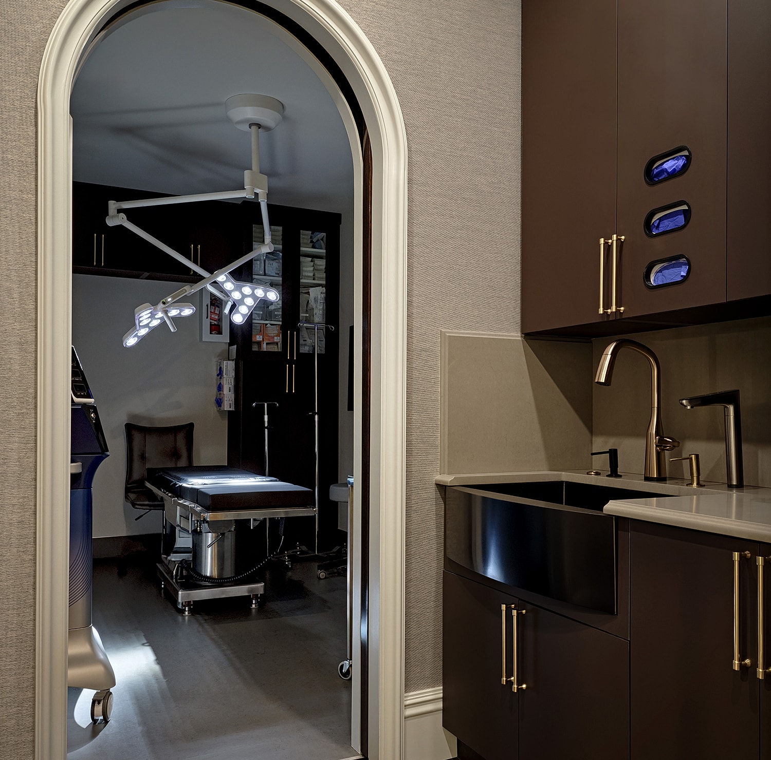 Medical room with lighting and equipment visible.
