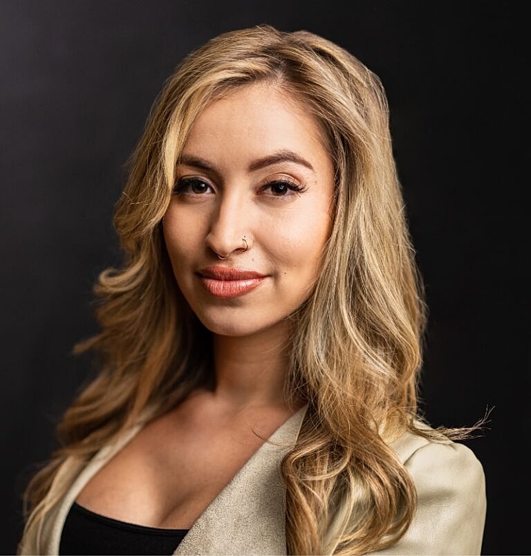 Portrait of a woman with blonde hair.