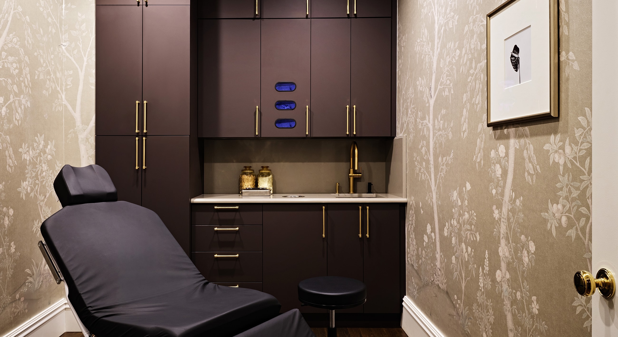 Modern medical treatment room with elegant decor.