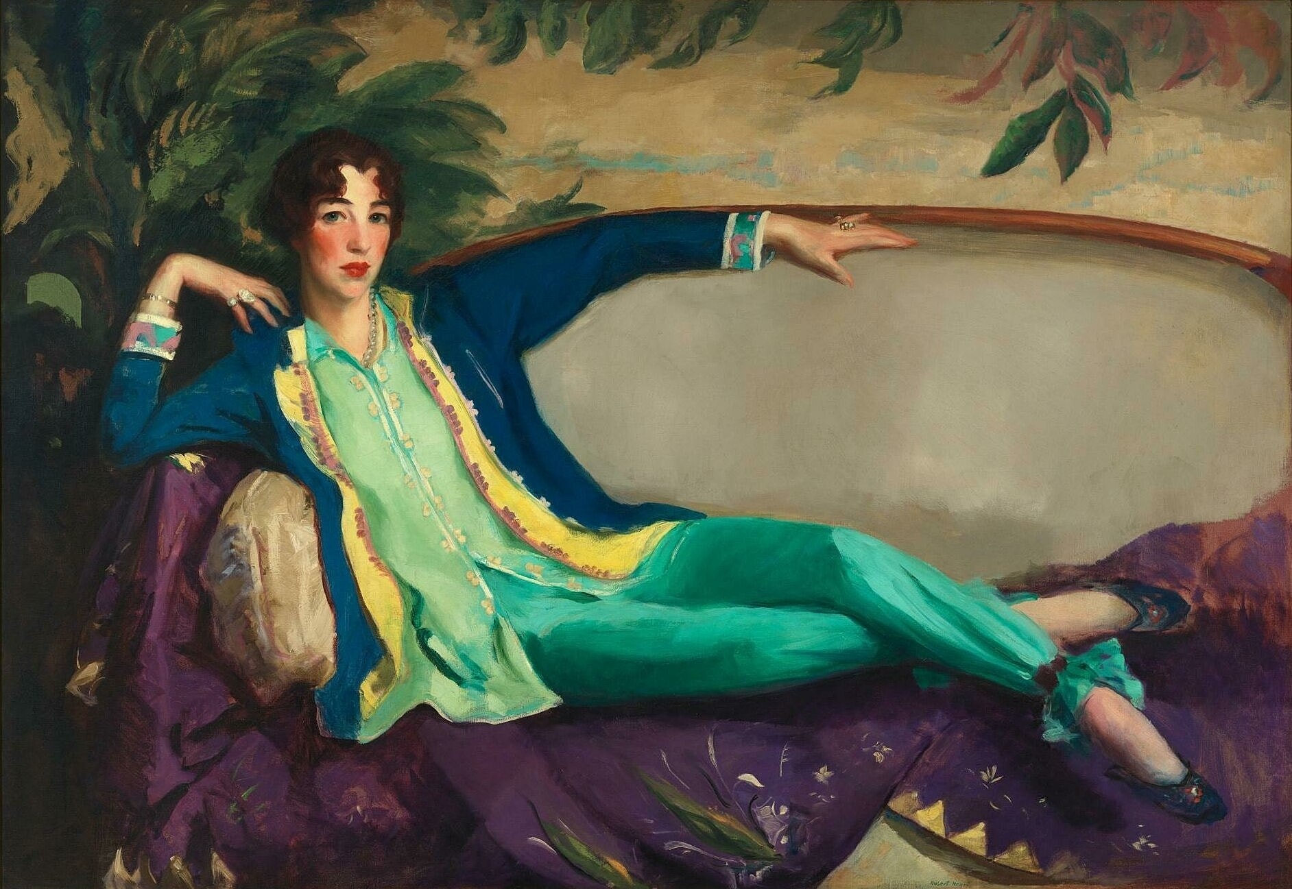 Woman reclining in vibrant, stylish clothing.
