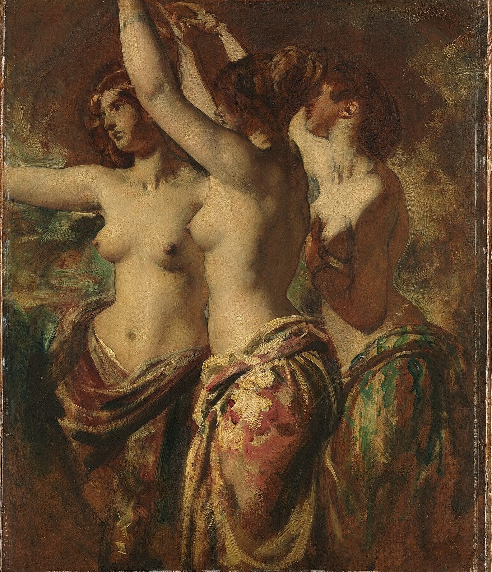 Three women draped in colorful fabrics embracing.