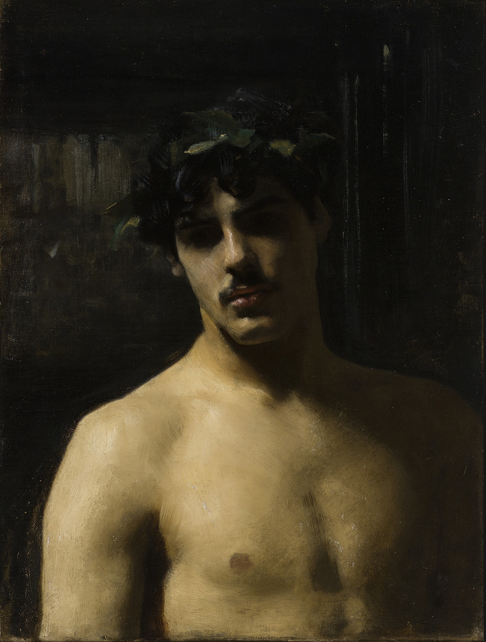 Portrait of young man with leaf crown.